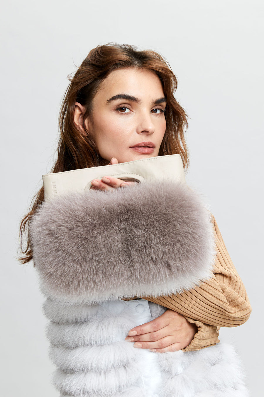 Lady modelling with a Fur bag