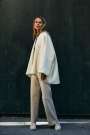 The kimono style coat has an interesting silhouette and the light tweed fabric makes the coat flow beautifully with every move.