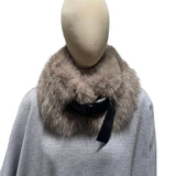 A beige fox fur collar with a plastic clip