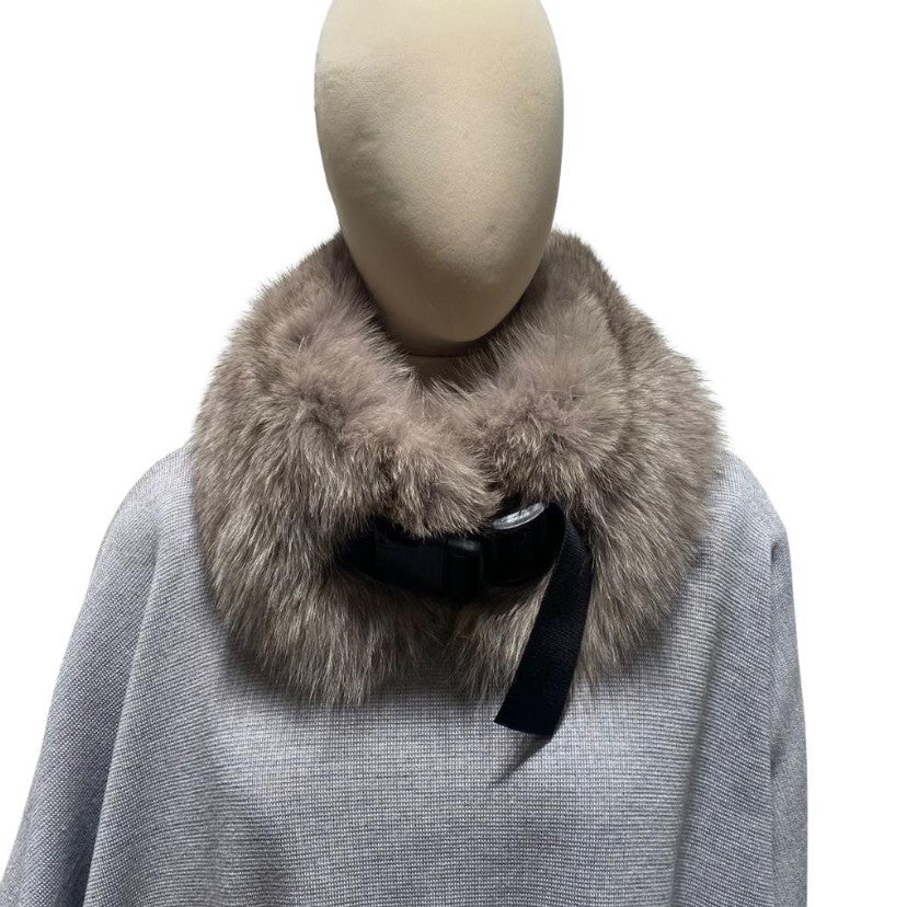 A beige fox fur collar with a plastic clip