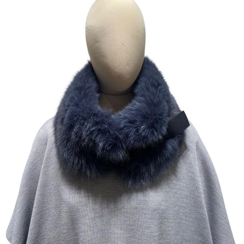A blue fox fur collar with a large plastic clip 