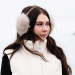 woman wearing fox fur earmuffs 