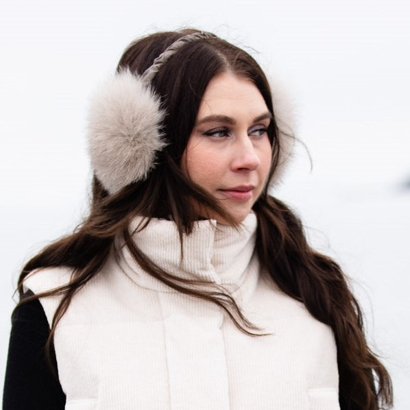 woman wearing fox fur earmuffs 