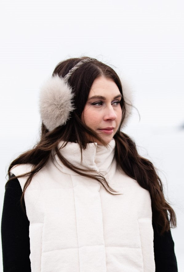 woman wearing fox fur earmuffs 