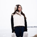 a lady wearing warm, luxurious fox fur mittens