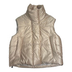 a puffer gilet in light gold color 