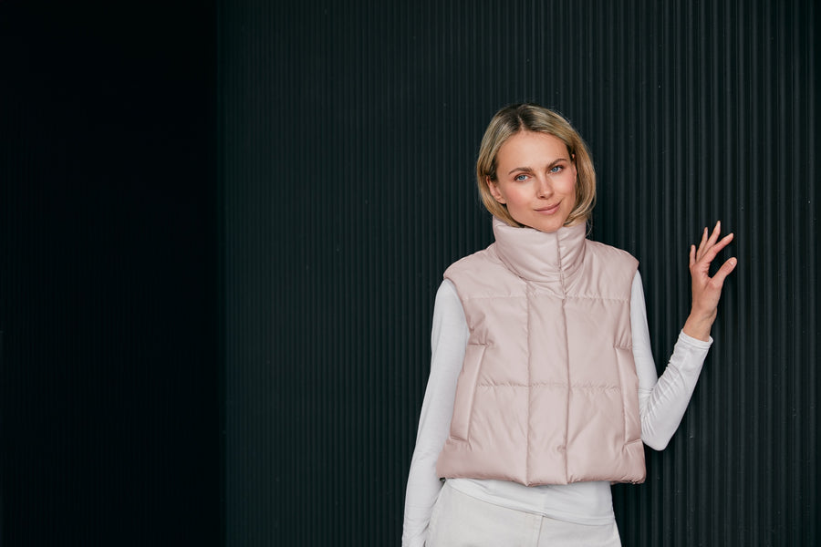 woman-wearing- a light-pink-croped-puffer-vest