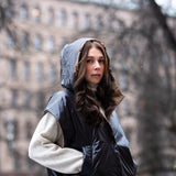 woman wearing a cropped light puffer gilet with hood 