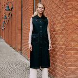 a lady wearing a long vest made from denim fabric 