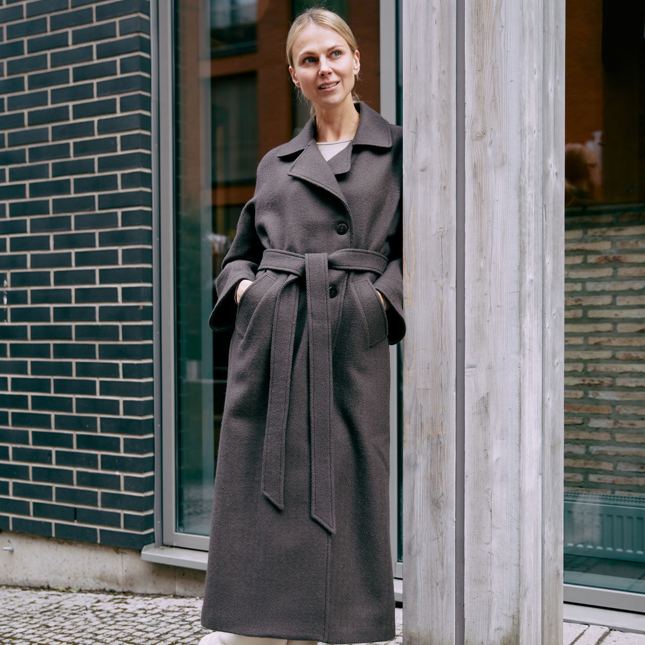 a woman's tweed coat in brown colors made in Finland 