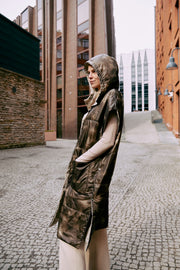 A lady wearing an ultralight warm puffer vest that is reversible and  easy to wear 