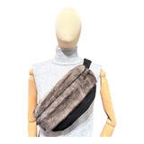 An spacious  cross-body bag for women and men, made from mink fur