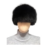 A black fox fur hat in pillbox style, made in Finland from real fox fur skins sourced from  Saga FUrs 