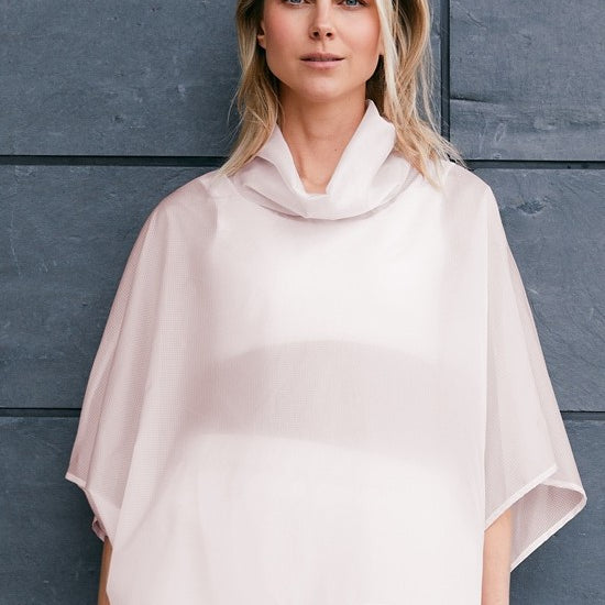 woman wearing a pink sheer windbreaker anorak for summer 