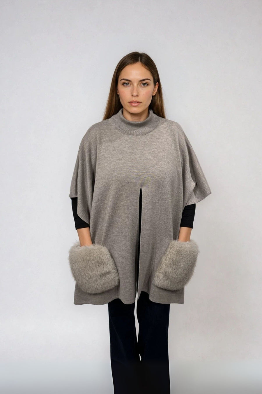 KNITTED PONCHO WITH FUR POCKETS