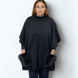 KNITTED PONCHO WITH FUR POCKETS