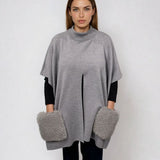KNITTED PONCHO WITH FUR POCKETS