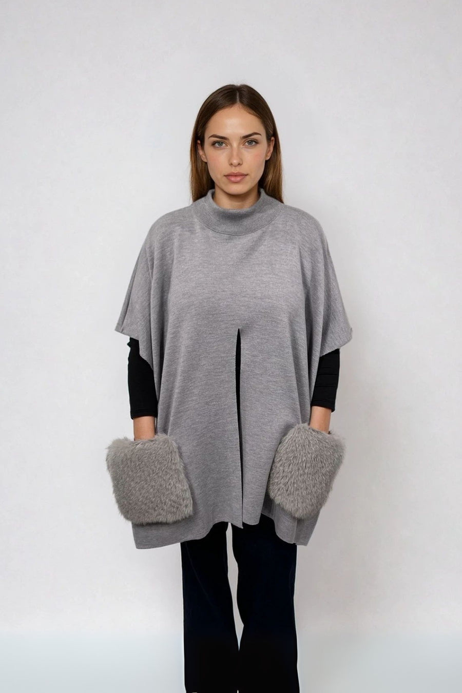 KNITTED PONCHO WITH FUR POCKETS