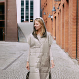 The light reversible puffer gilet is warm and versatile. The gilet is reversible and has push button closing.