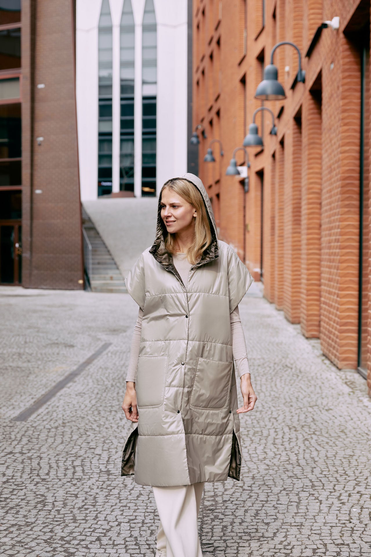 The light reversible puffer gilet is warm and versatile. The gilet is reversible and has push button closing.