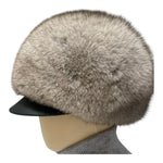 Fox fur hat, round model with leather brim in grey color 