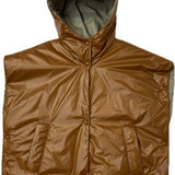 a short padded gilet with hood in orange color 