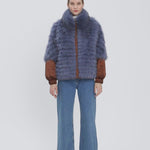 This jacket will be noticed on the ski-slopes.  Choose an all black version or a beautiful bright fabric with contrasting color fur hood. 