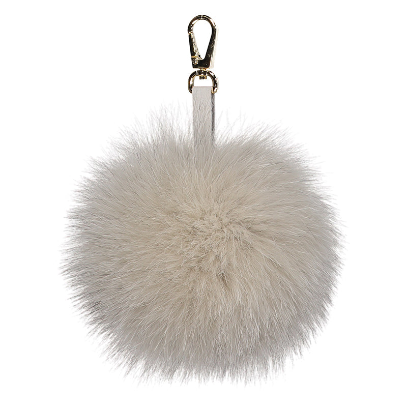 A Fox Fur pompom that can be used as a bag charm or key chain fur pompom