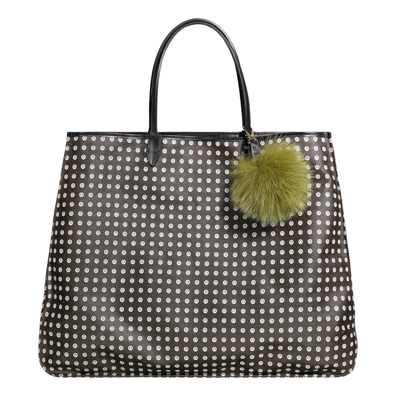 Fur pom pom decorating a black bag