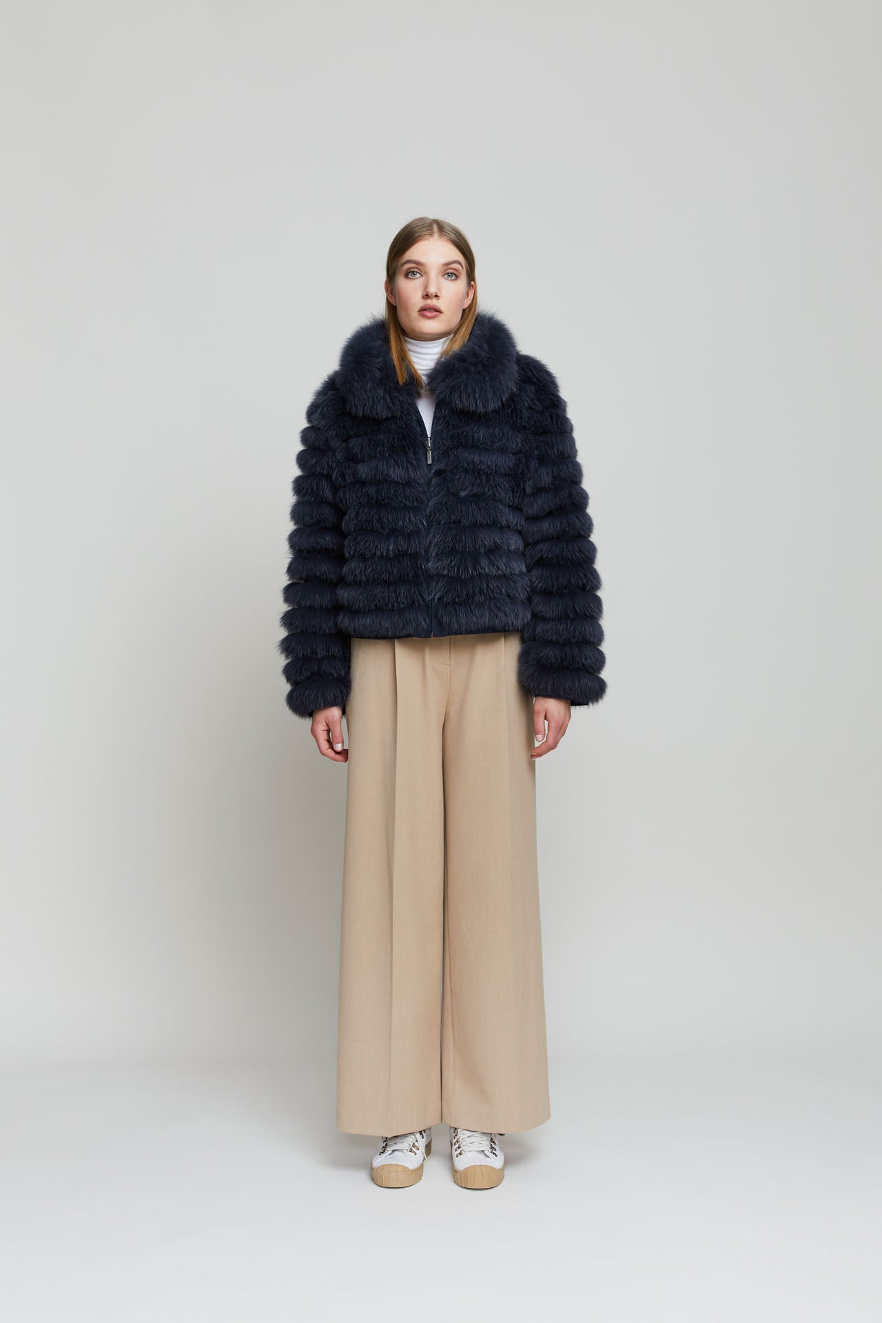 Cropped reversible women's black fox fur jacket.