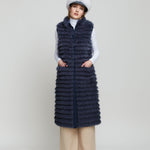 Women's long reversible fox fur vest with features fur pockets in a contrasting colour.