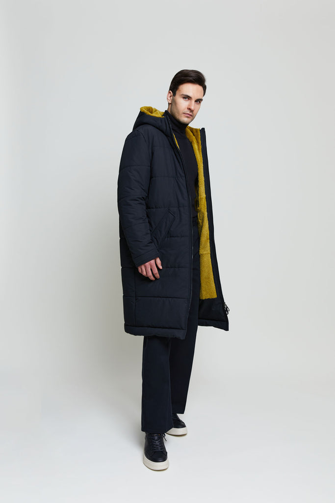 This extra long puffer coat with rabbit fur lining is the perfect outerwear for cold Winter days. 