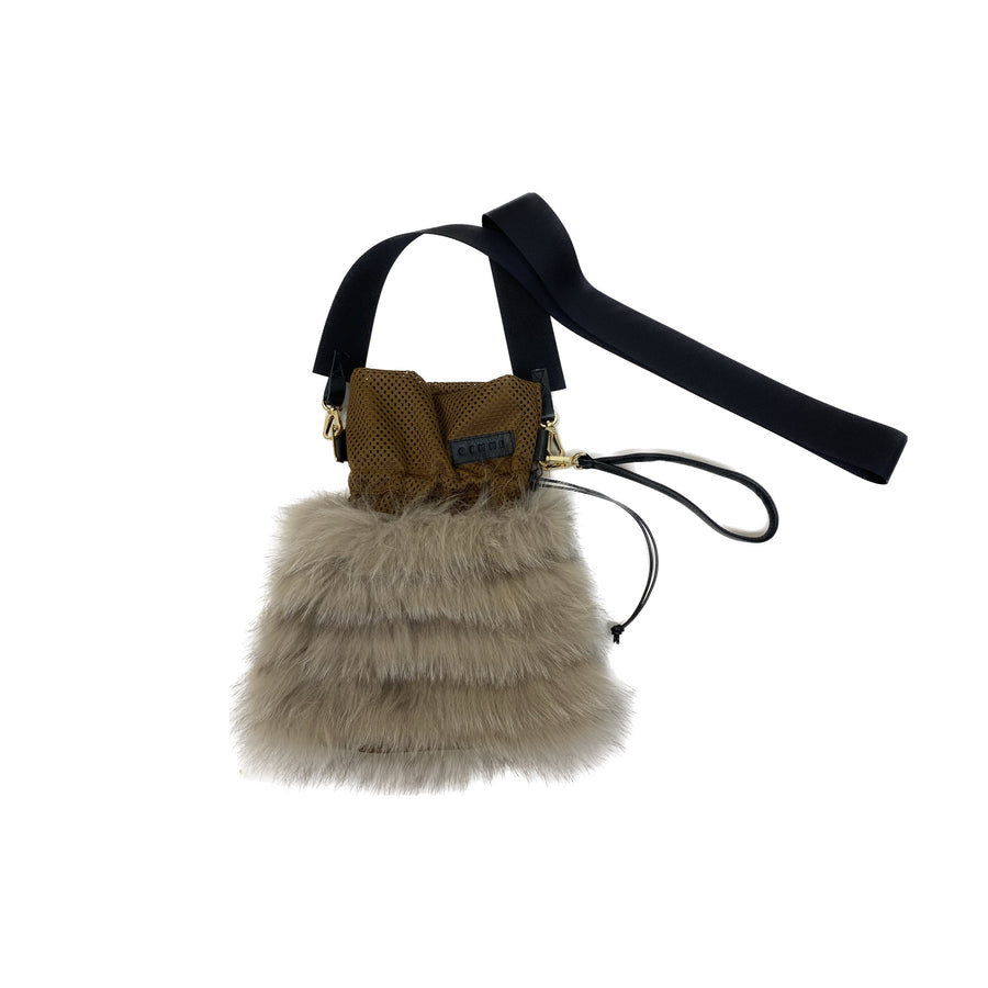 A cross-body pouch made of a strong mesh fabric and fur strands