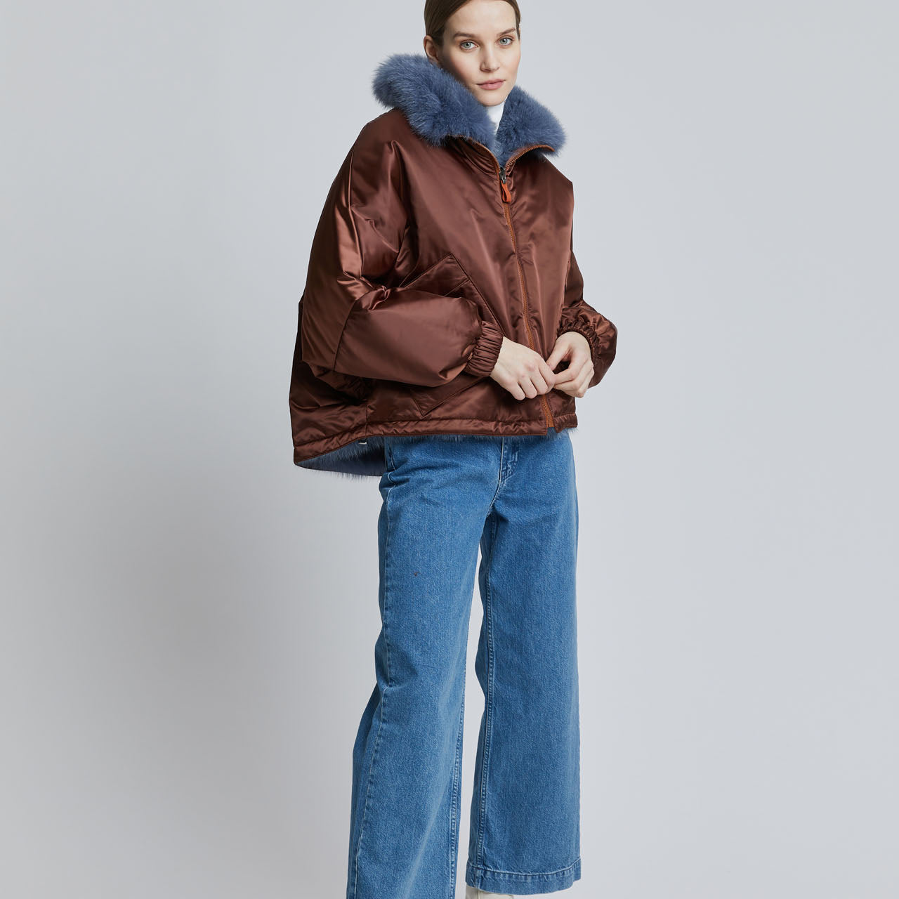 Lady modelling a fur bomber jacket, with luxurious fox fur lining.