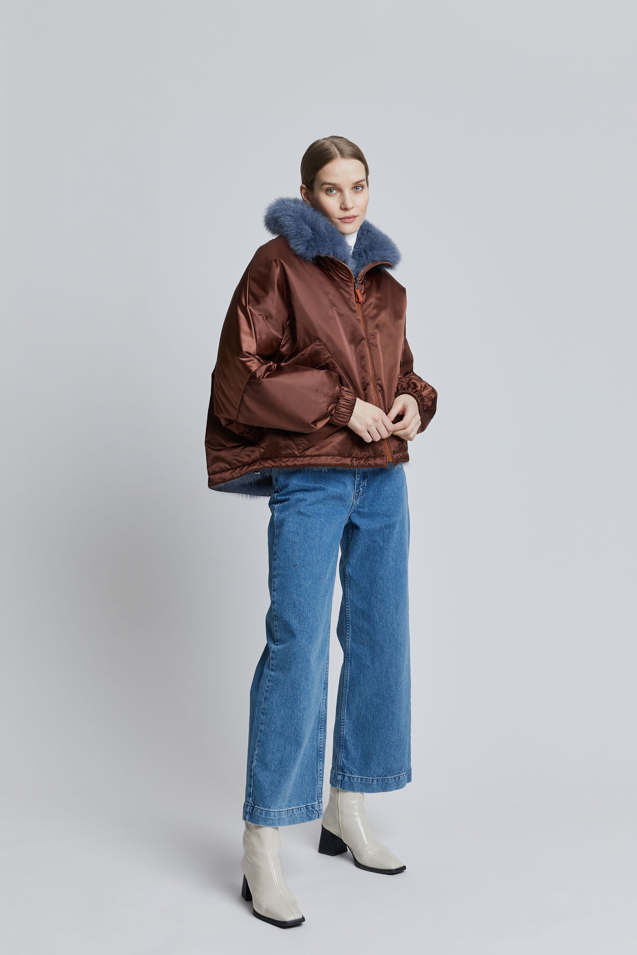 Lady modelling a fur bomber jacket, with luxurious fox fur lining.