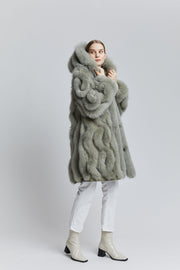 iconic reversible Gemmi coat with a hood has an A-lined shape