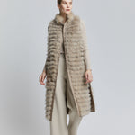 long reversible fox fur vest with features fur pockets in a contrasting colour.