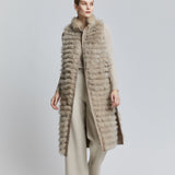 long reversible fox fur vest with features fur pockets in a contrasting colour.