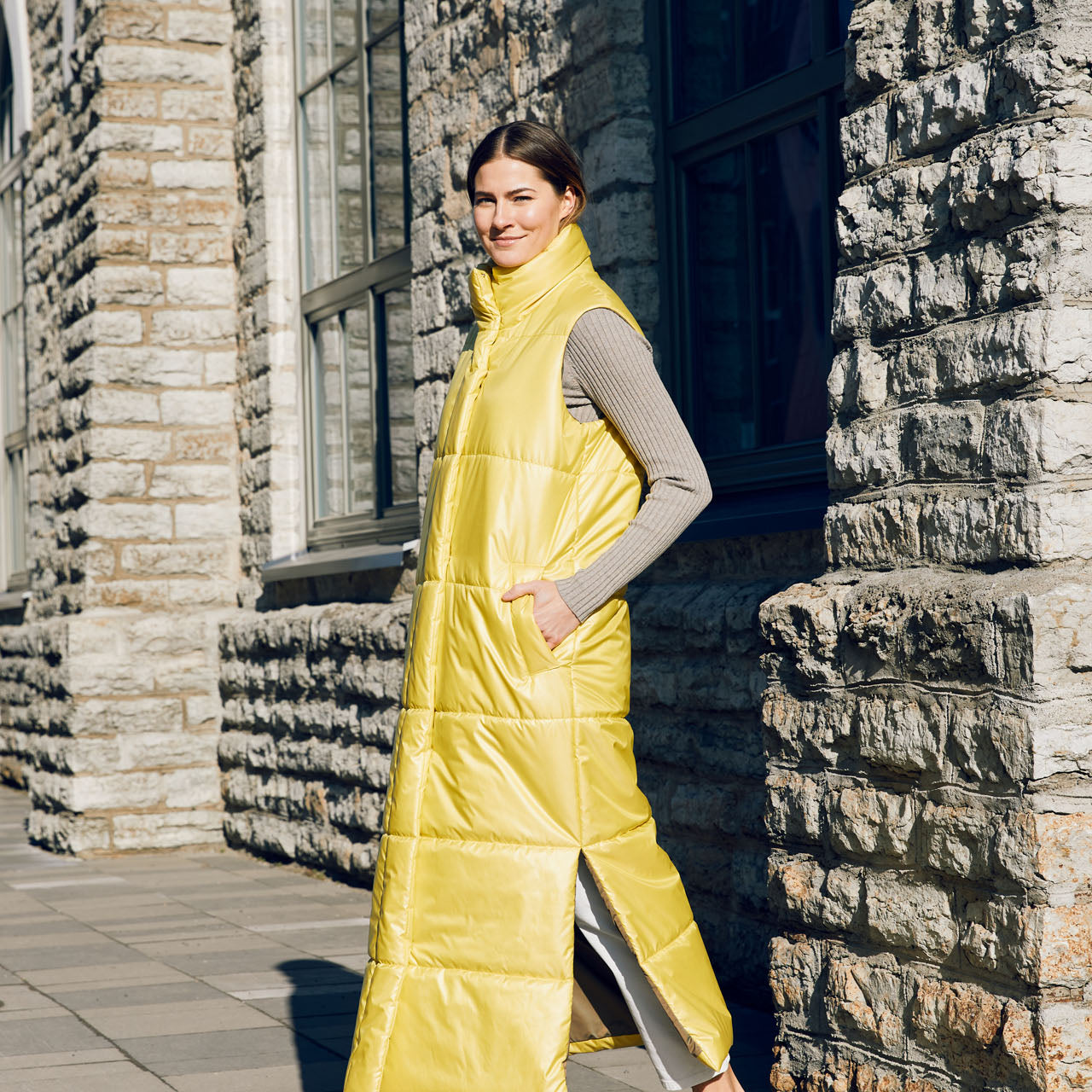 The extra long vest is made from windproof and water repellent fabrics, with a soft down-like nonwoven lining