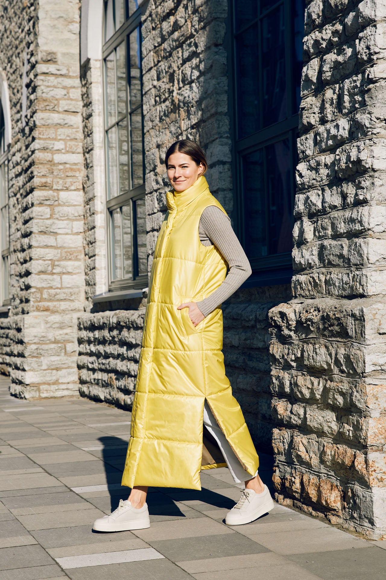 The extra long vest is made from windproof and water repellent fabrics, with a soft down-like nonwoven lining