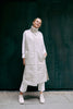 a lady wearing Gemmi's long puffer vest that is made from windproof and water repellent fabric and down-like, soft nonwoven padding. The long puffer vest  is available in many beautiful colors. 