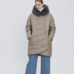 Young-lady-modelling-a-puffer-coat-has-a-rounded-back-an-asymmetric-front-zipper-and-two-side-pockets