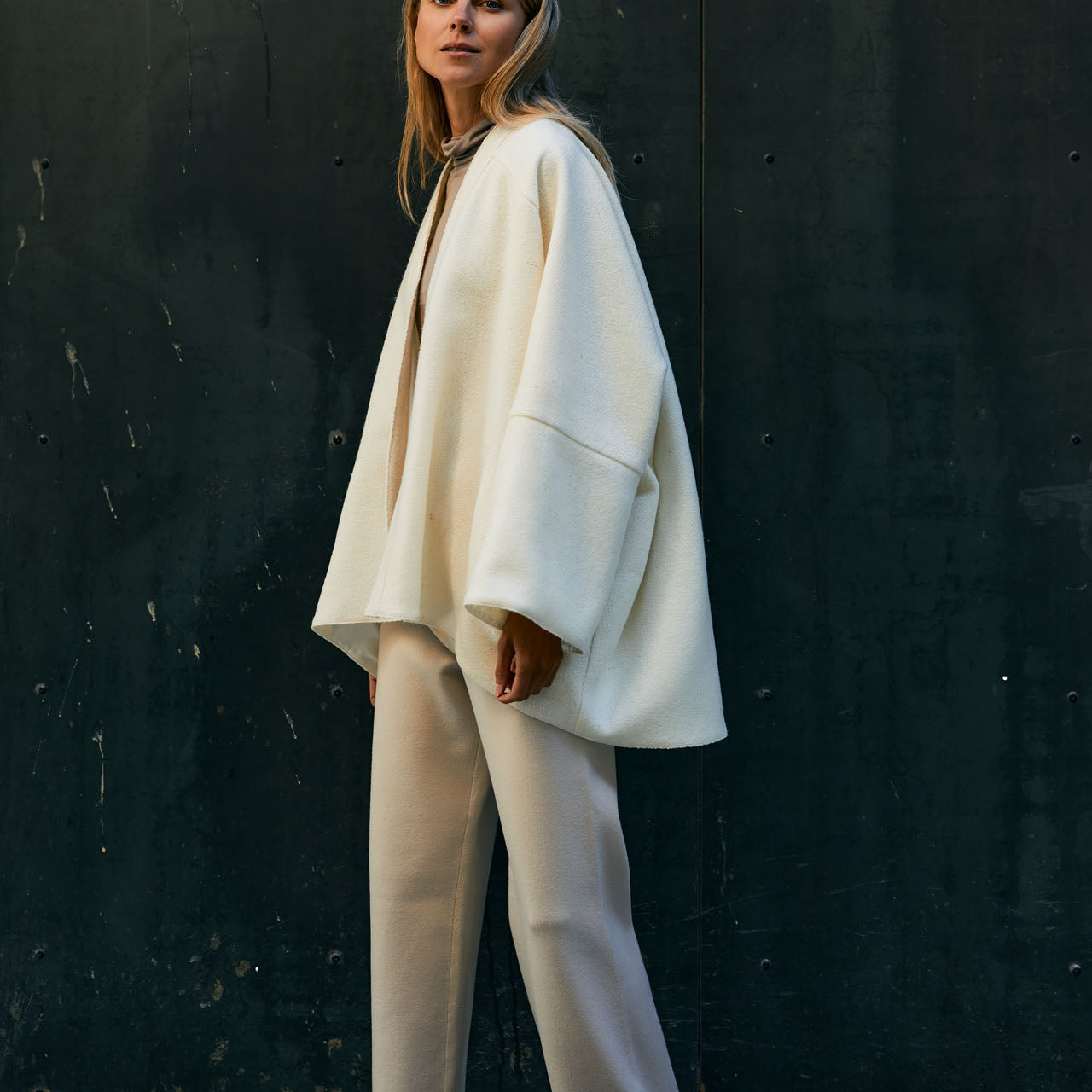 The kimono style coat has an interesting silhouette and the light tweed fabric makes the coat flow beautifully with every move. 