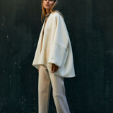 The kimono style coat has an interesting silhouette and the light tweed fabric makes the coat flow beautifully with every move. 